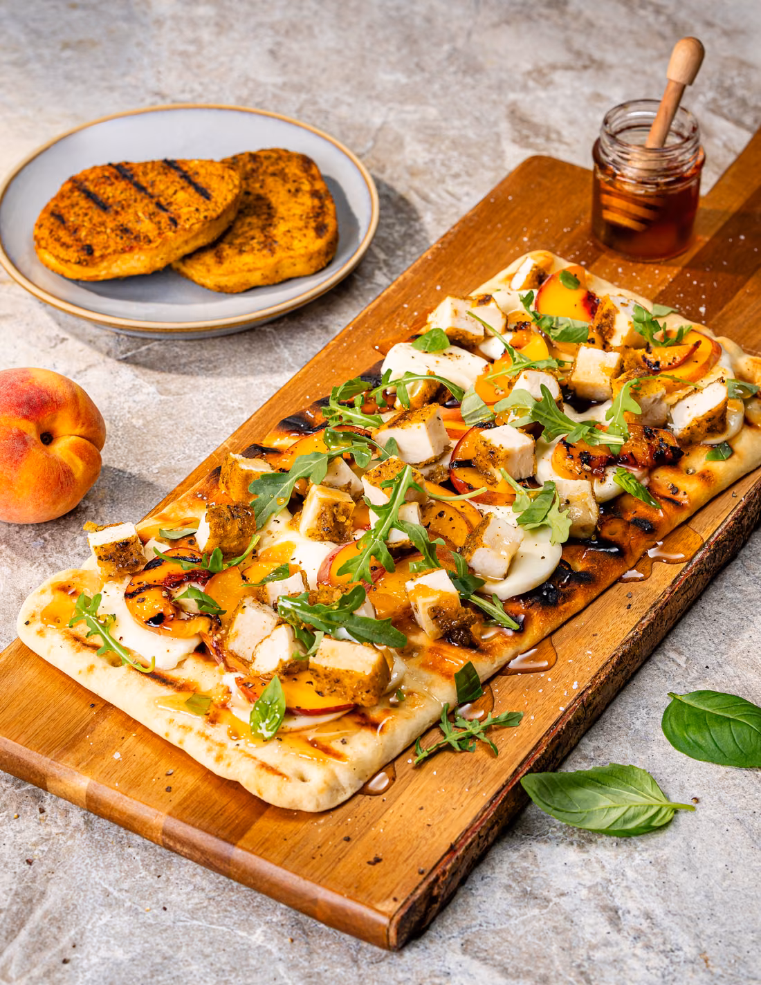Hot Honey Chicken & Peach Flatbread, made with Skinny Butcher Crazy Grilled Chicken Patties